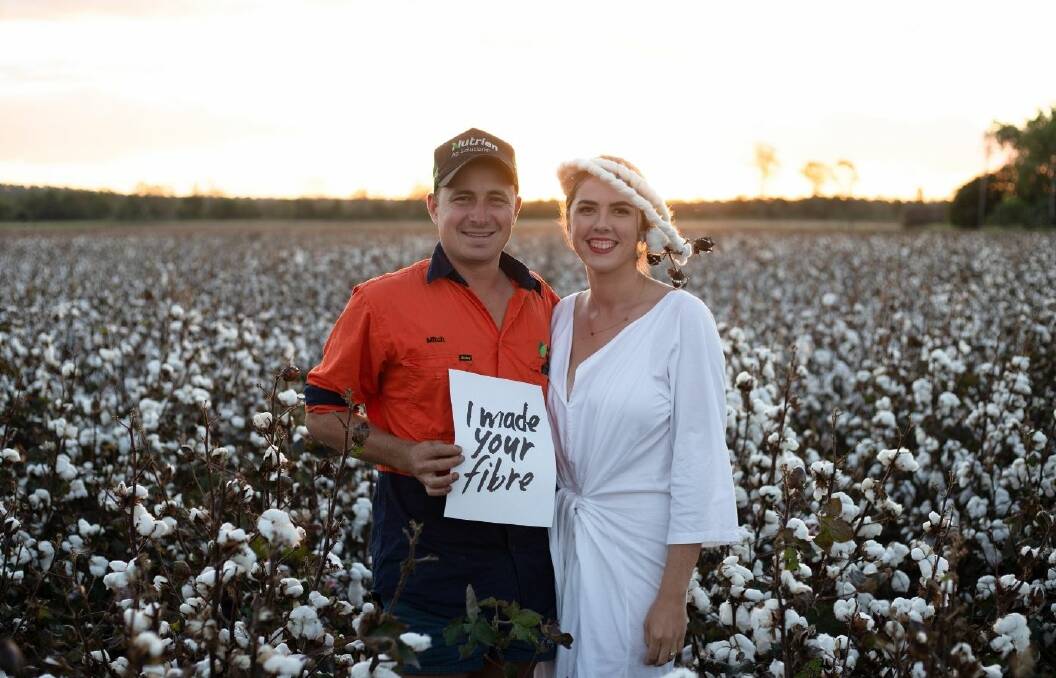 Mitch Brimblecombe with Emma Bond in his cotton crop in the Lockyer Valley.