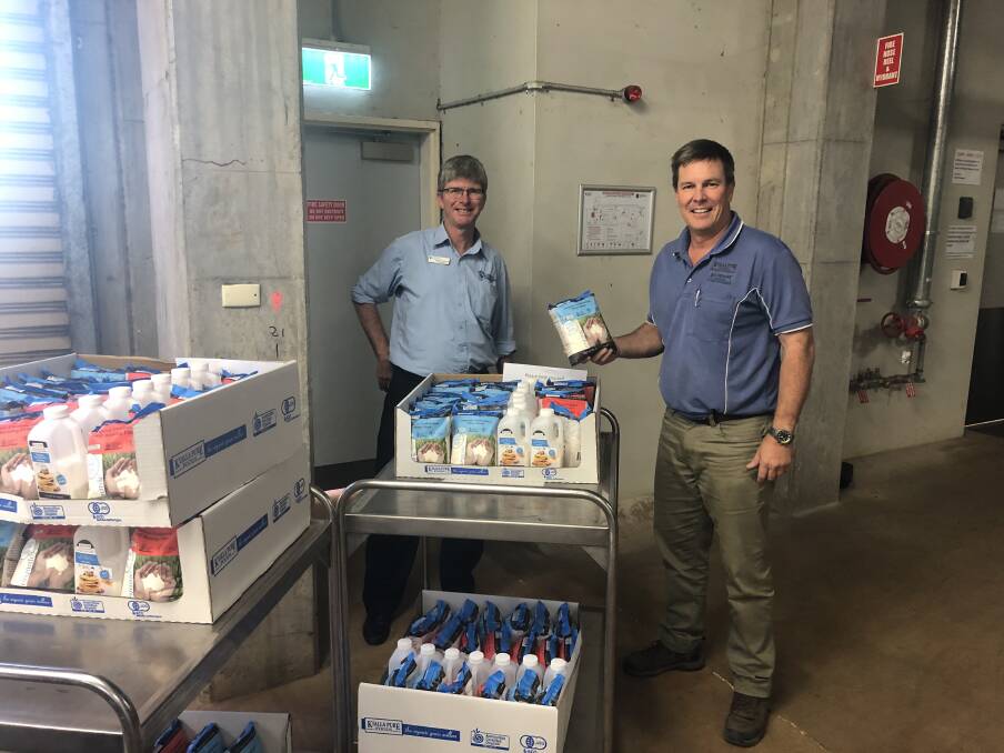 Dr Mark Copland, Mission Executive, St Vincent's Private Hospital ,Toowoomba accepts the Kialla Pure Food donation from managing director Quentin Kennedy. 