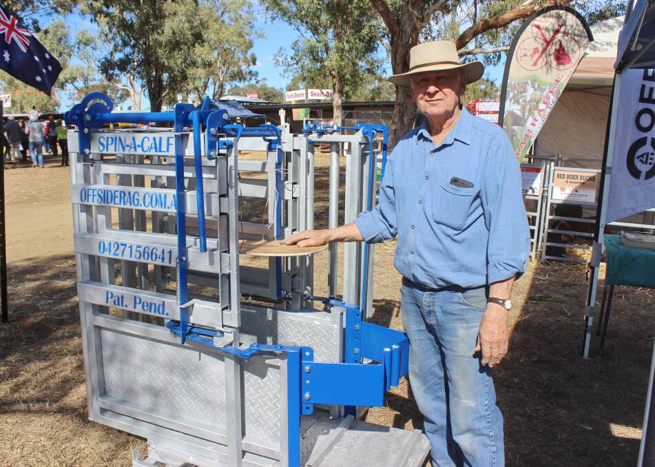 Gerald Hicks, Toowoomba, demonstrates the new release of the Spin-a-Calf cradle in the livestock section at FarmFest. 