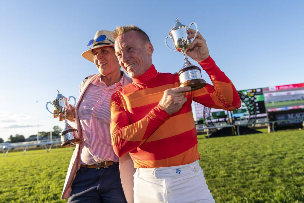 Metropolitan horse trainer Desleigh Forster with winning jockey Jim Byrne after Apache Chase won the Kingsford Smith Cup at Eagle Farm Racecourse on Saturday. 