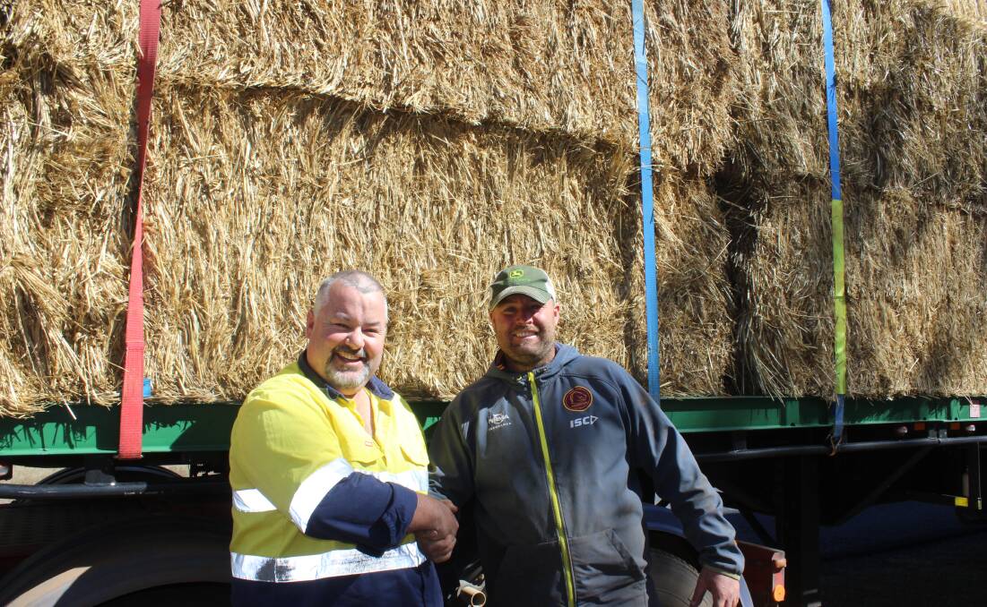 Dairy farmer Ashley Gamble meets Norm Mundy on the side of the road at the outskirts of Oakey to escort him to his farm to deliver the gift of hay.
