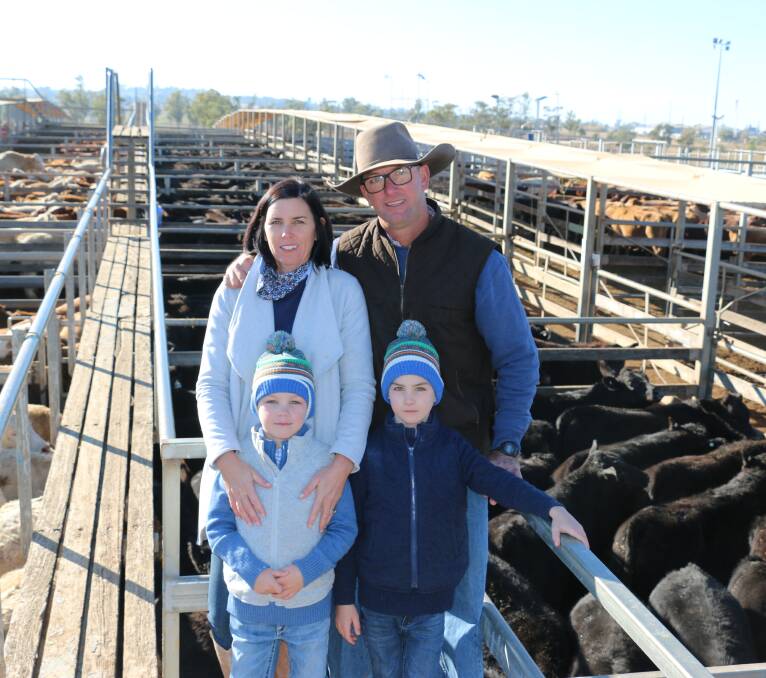 Julie and Jeremy Shaw with sons Leo and Henry were on hand to see their weaners sell at the Roma Saleyards. Photo - Annabelle Murphy, Roma Regional Council.