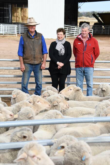 Errol annd Candy Brumpton, Well Gully, Mitchell, with Elders Sheep and Wool specialist Peter Sealy, offered 1806 elite Merino ewes and reached a top price of $7225 during their dispersal sale through AuctionsPlus last week. Picture Jane Lowe.