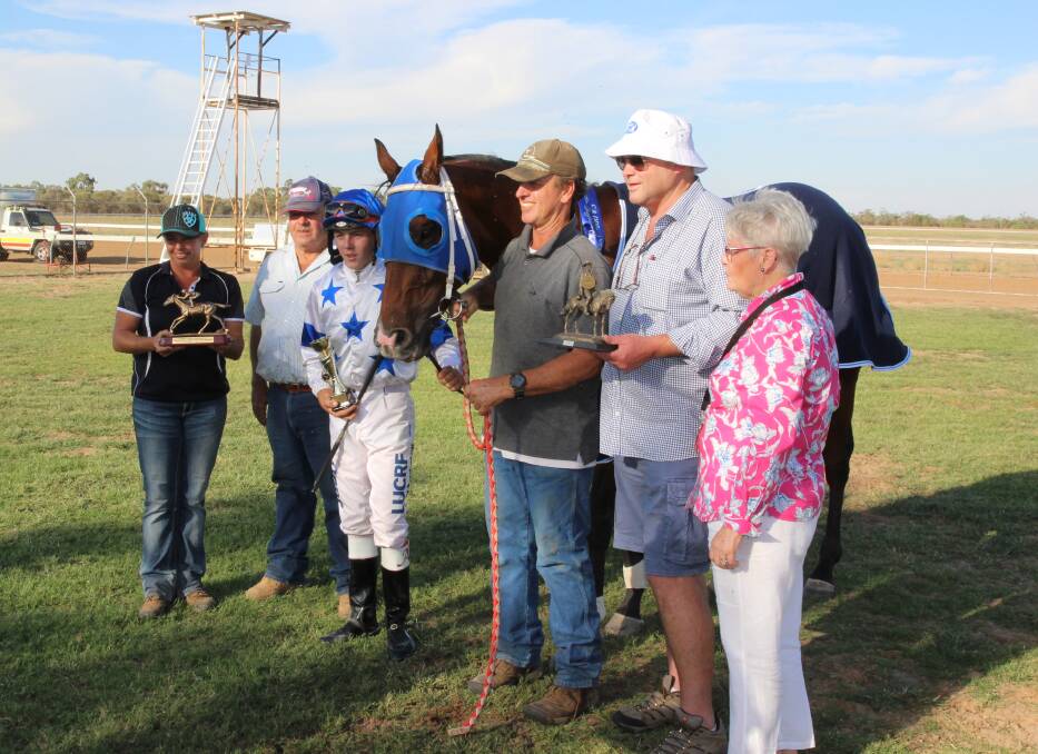 The connections of Fab's Cowboy with race sponsors David and Liz Land, and Racing Queensland's Battle of the Bush Hall of Fame trainer, Peter Moody. Picture: Cunnamulla  and District Diggers Race Club.