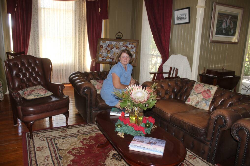 Sandra Jenner in the guests sitting room furnished with leather lounge suite and mahogany antique furniture. Picture Helen Walker