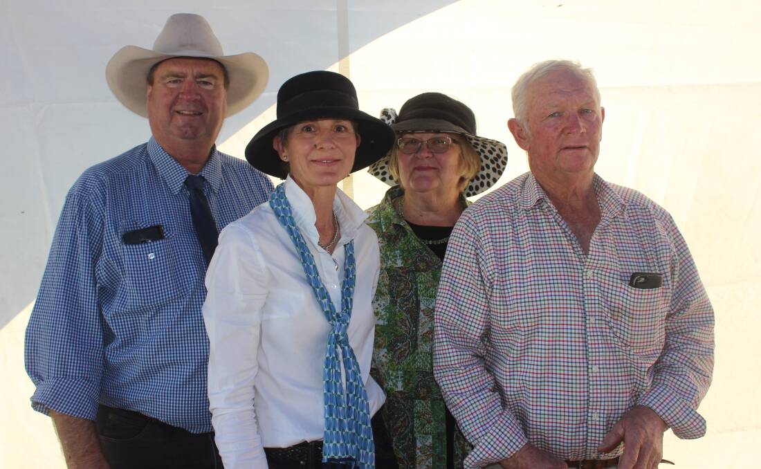 GDL auctioneer, Peter Brazier, with Norah Cass, ANC Full French Charolais, Guluguba,  with buyers of the top priced bull at $26,000, Dell and Ian Price, Moongool Charolais, Yuleba.  
