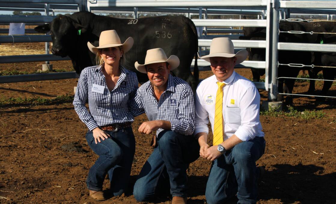 Top price Brangus bull JKCattle Co Rollinstone sold for $29,000 and is pictured with Kate and Justin Boshammer, and David Felsch, Ray White Rural, Dalby.