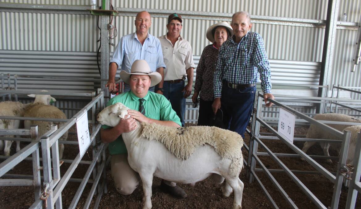 David Curtis, and Nick Pagett, Bellevue Stud, Millmerran with Christine and Peter Donaldson, Karoola Stud, near Inverell, and Gus Foott, Nutrien, Charleville, with the $18.500 White Dorper ram. Picture Helen Walker. 