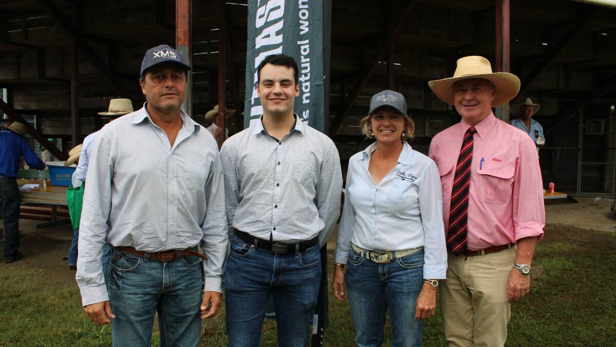 Buyer of the top price female Paul Lever and his son Mykey, Leverdale Droughtmasters with Colleen Smith Vale View Droughtmasters, and auctioneer Andrew Meara. 