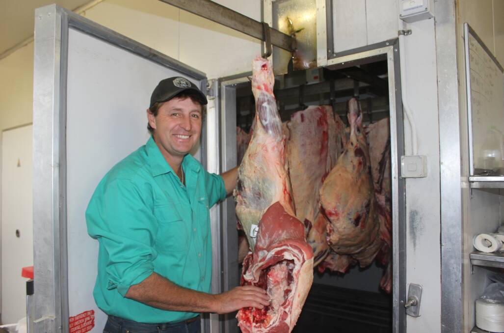 Kieren Luck, Bannock Brae Meats, with a carcase weighing 254kg ready to be processed into cuts of meet. 
