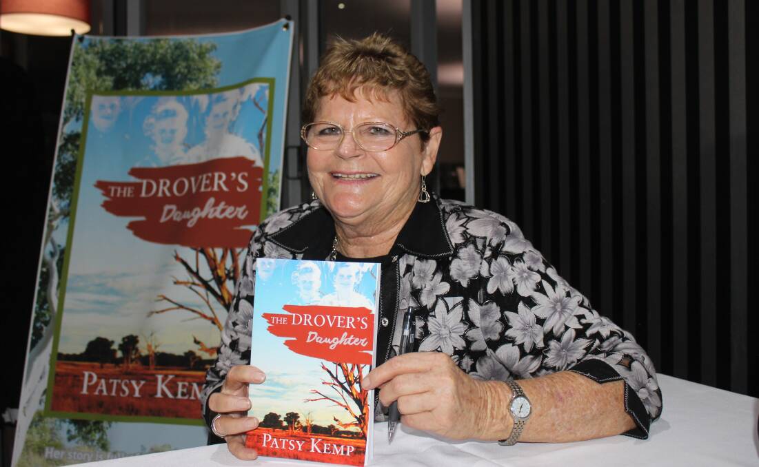 Published author Patsy Kemp autographs her recently launched book, The Drover's Daughter.  Picture Helen Walker  