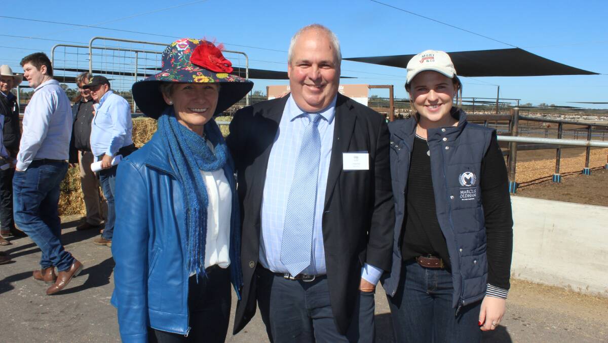 Donna Atkinson is congratulated by old friend Charlie Mort of Grassdale Feedlot and daughter Alice, 