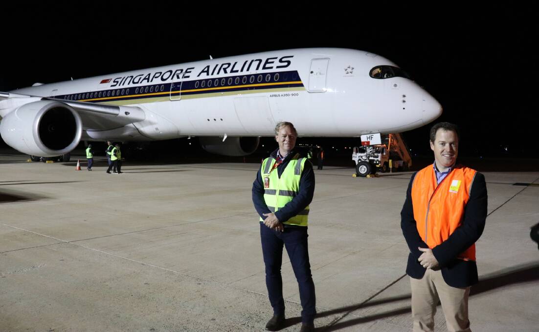 Robert Kasch, Wellcamp Airport with Bruce McConnel, TSBE welcoming the latest Singapore Airlines freight service to the Darling Downs. 