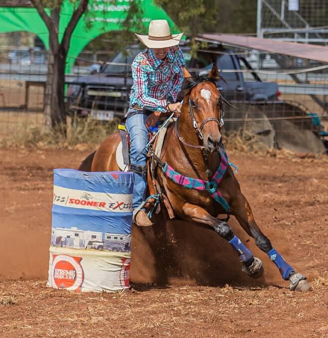 Kristy Banks, putting Bob around the barrels in a barrel racing competition. 