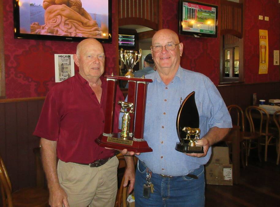 Alwyn Wolfe received his grand championship carcase award from Limo Blockbuster Hoof and Hook competition organiser Geoff Haack.