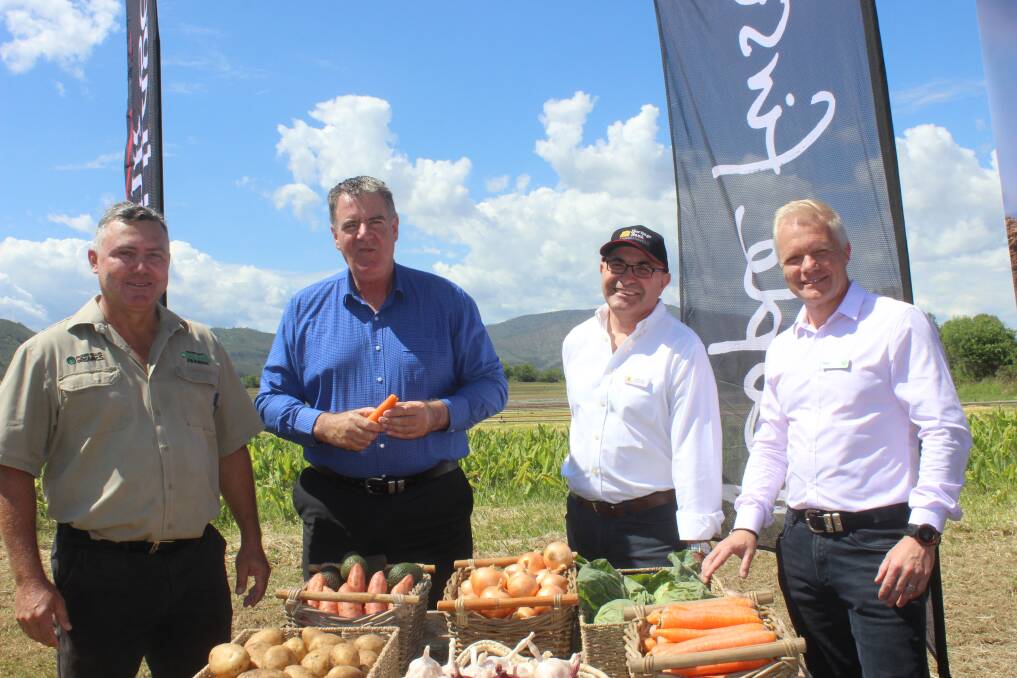 Organic farmer Anthony Bauer, Minister for Agricultural Development and Fisheries, Mark Furner, CEO Heritage Bank Peter Lock, and Woolworths Supermarkets head of produce, Paul Turner.  Picture: Helen Walker