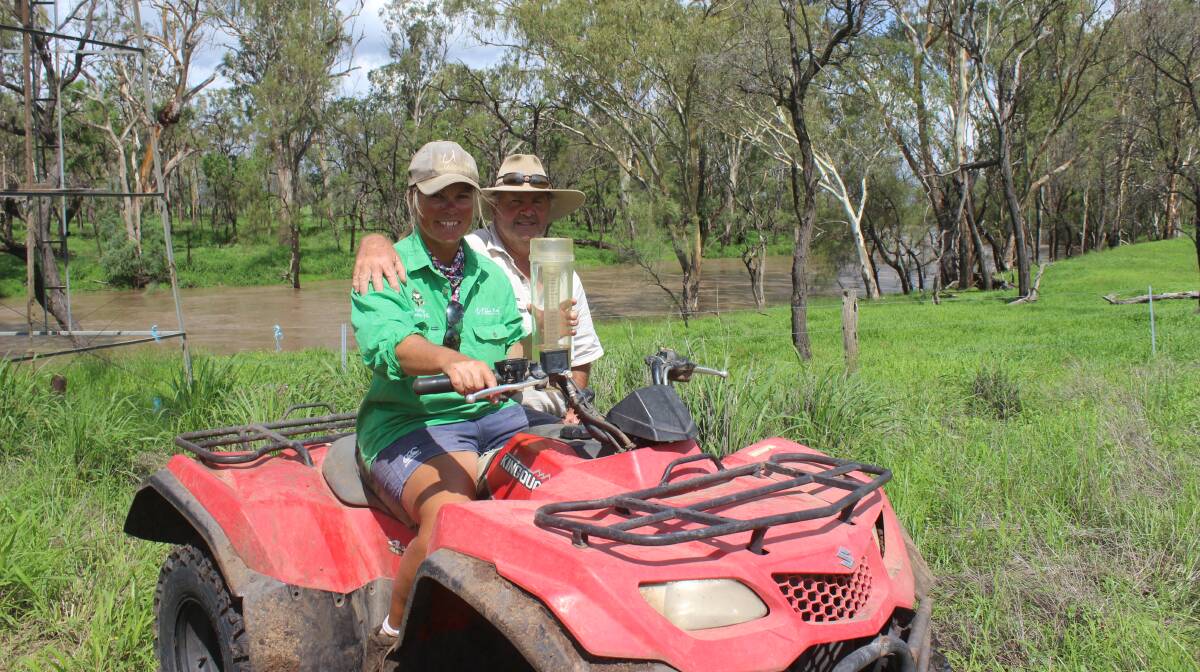 Here it comes: Elisabeth and Rodney Skene are keeping an eye on the Condamine River as it flows through Meldon Park, Cecil Plains, after heavy rain fell upstream earlier in the week. Picture: Helen Walker
