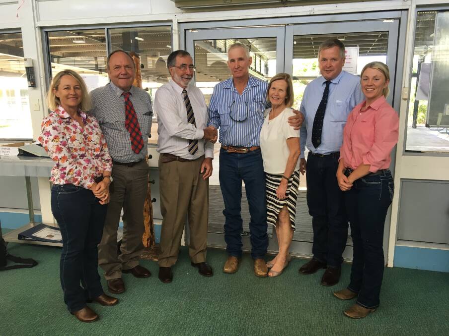 John Arnold (centre) being congratulated for 30 years of instructional service at Longreach Pastoral College, by the LPC Local Board Katrina Paine, Ian Duncan, Richard Pietsch, Rosemary Champion, Tony Rayner, and guest member Allycia Bennett.