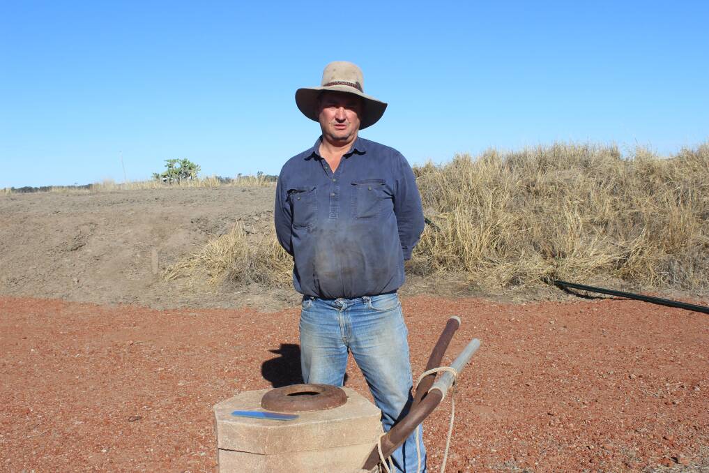 Rumbling gas: Brian Bender, Valencia, Hopeland near Chinchilla, with a water bore in the process of being decommissioned. Picture: Helen Walker