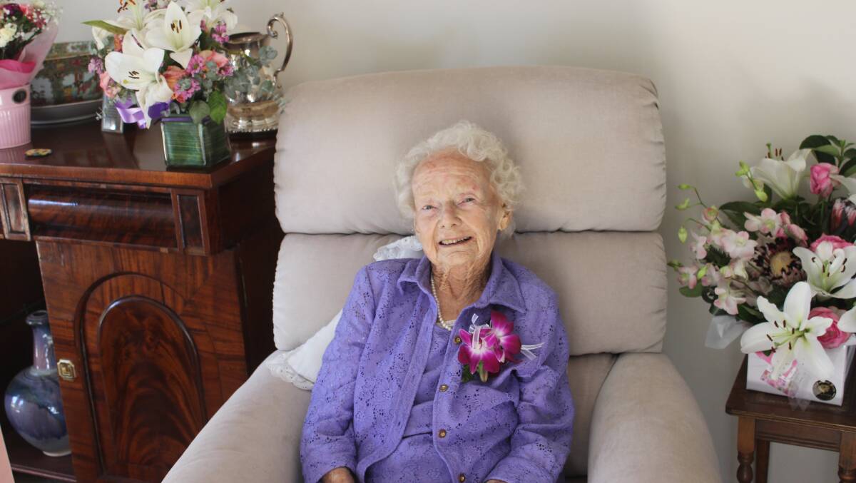 Erla Irving is surrounded by bunches of flowers everywhere in her unit. Pictures: Helen Walker  