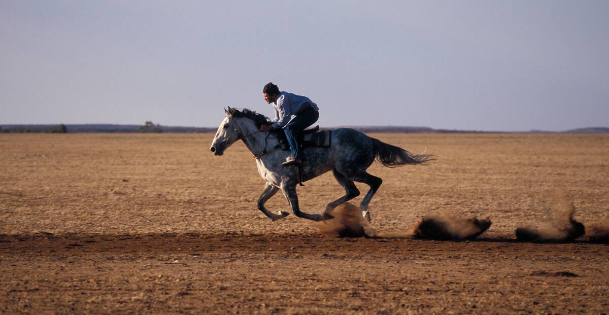 Clive gives Blue Osier a lap, Durham Downs in Queensland's Channel Country, taken 2007.