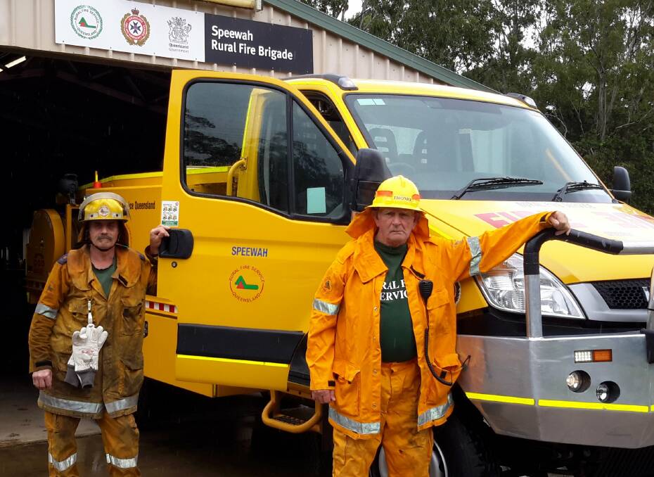 Thousands of volunteer firefighters like Mick Dub and John Thomson from Speewah Rural Fire Brigade face uncertainty over the impact of a QFES restructure. 