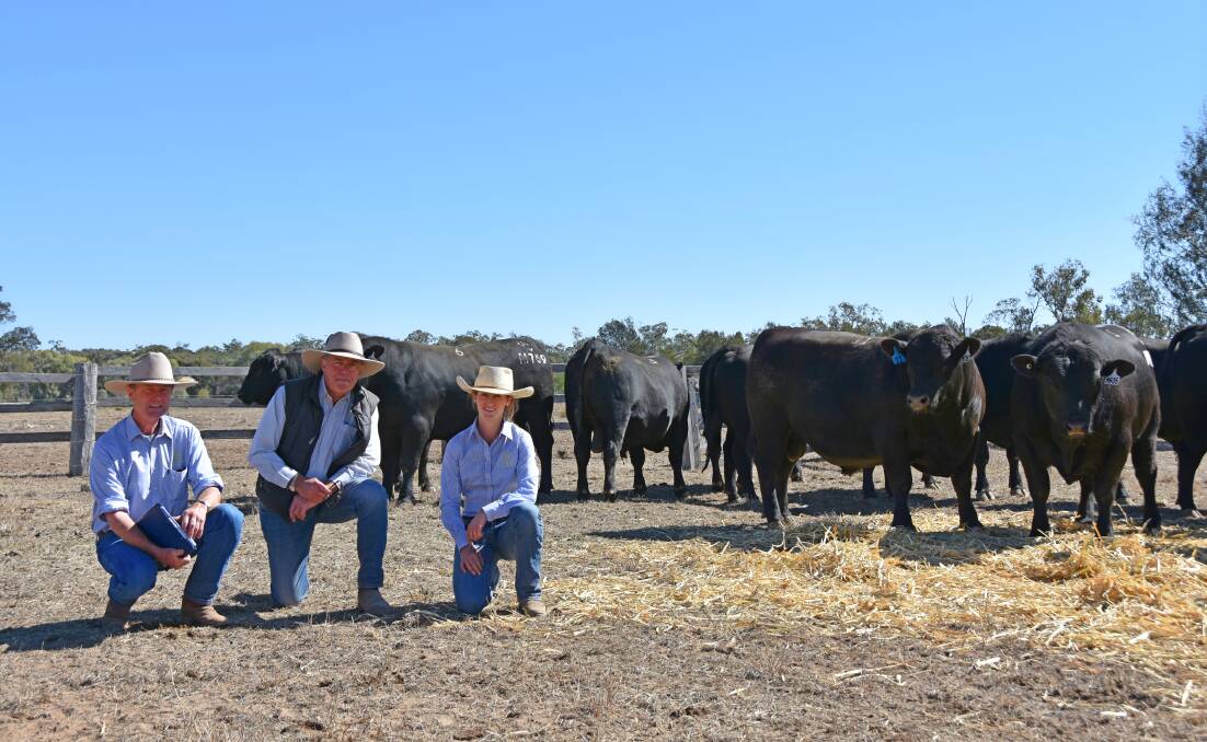 Jim Litchfield, Hazeldean Angus, with Kevin Graham representing buyers Alister and Joanne McClymont, Burleigh Station, Richmond, who purchased the top priced bull, Hazeldean M995, for $15,500, and Bea Litchfield, Hazeldean Angus.
