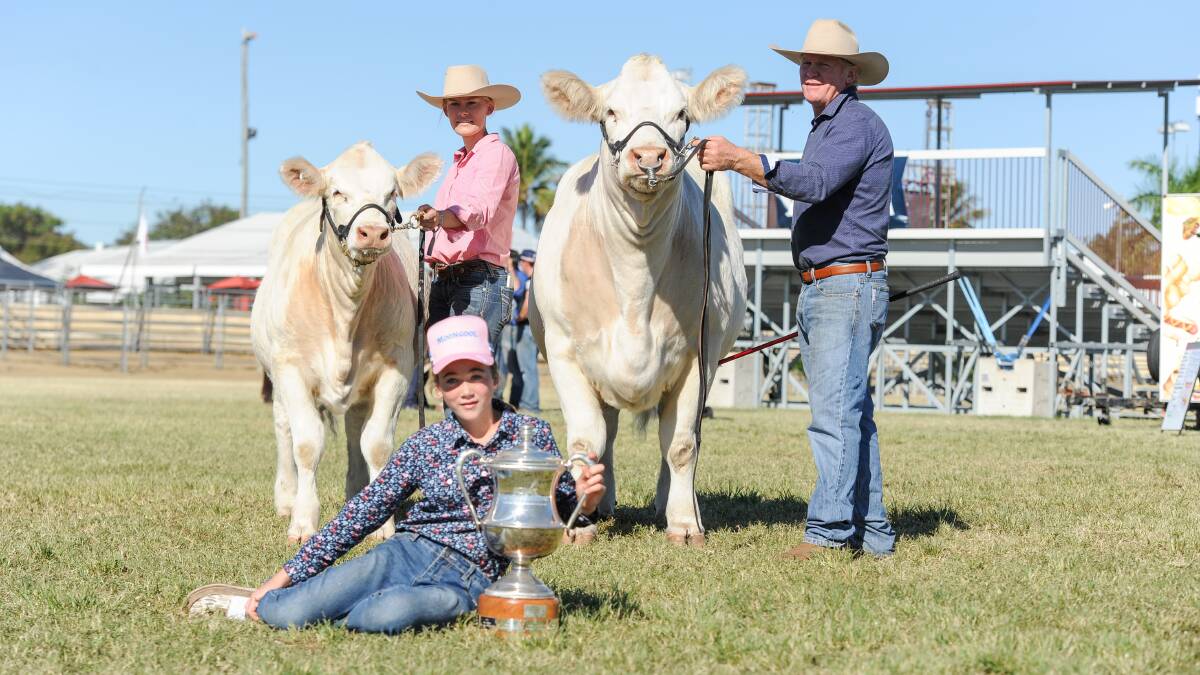 Chloe Kemph, Tory Price, 11, and Ivan Price, Moongool Charolais, Yuleba, with the interbreed champion female Moongool Radical 26 and her calf Moongool Radical 27. Picture: Lucy Kinbacher