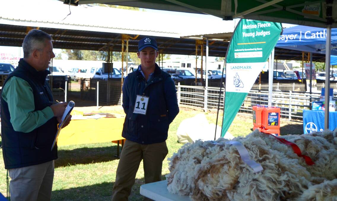YOUNG TALENT: Will Hacker during the Fleece competition at the state sheep show with overjudge David Hart.