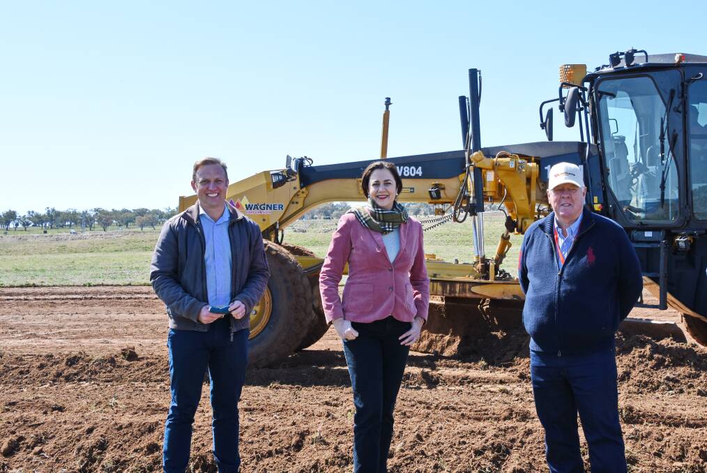 Deputy Premier Steven Miles, Premier Annastacia Palaszczuk and Wagner Corporation chairman John Wagner at the construction site of the Queensland Regional Accommodation Centre.