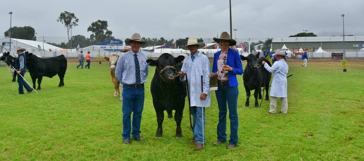 Queensland Agricultural Training Colleges chief executive officer Mark Tobin, Young Paraders champion Western Wendt, Treadstone Limousins, Mundubbera, and over-judge Cherie Gooding, Marlegoo Charbray Stud, Biloela. 