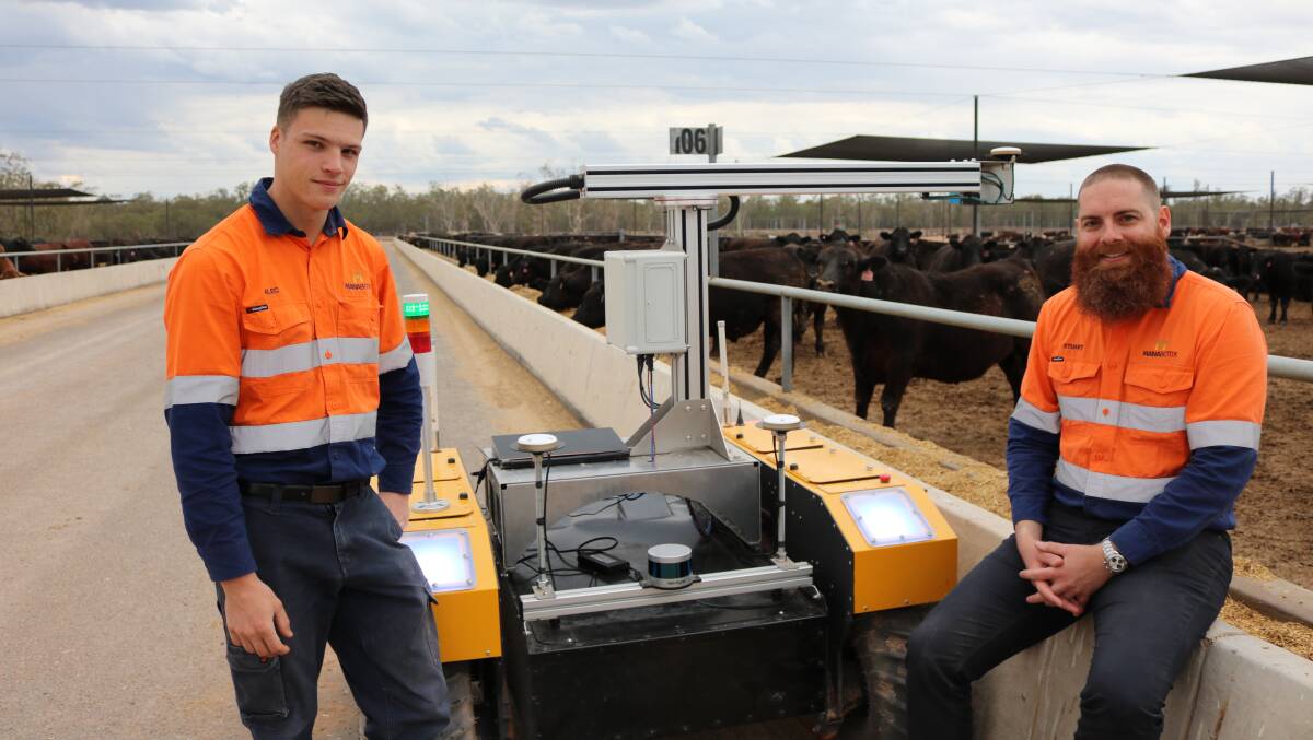 Alec Gurman and Dr Stuart McCarthy with Bunk Bot, which is one of a suite of automated feedlot products that have been commercialised over the past five years. Picture - MLA.