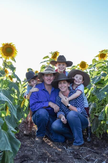 The McNaughtons with their sunflowers. 