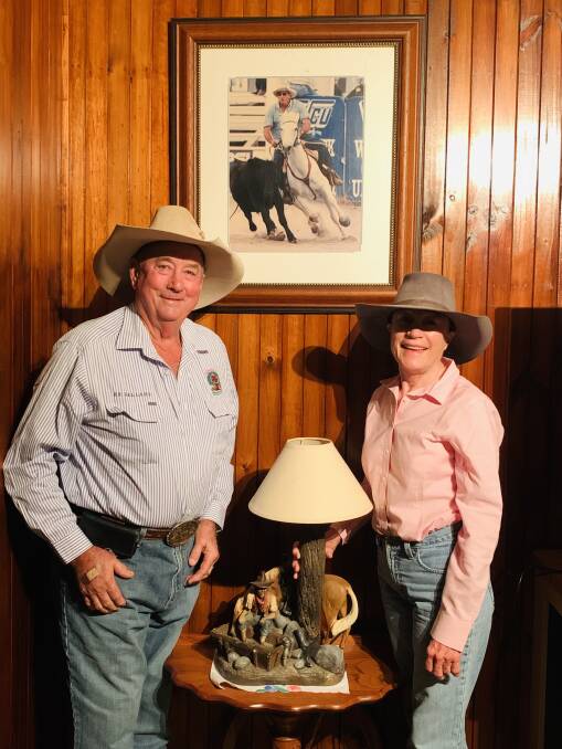 Evan and Kim Acton pictured at Millungera in front of a picture of Millungeras Moon Beam dam, Kirkbys Stud Blue Moon. Picture: Aaron Willis