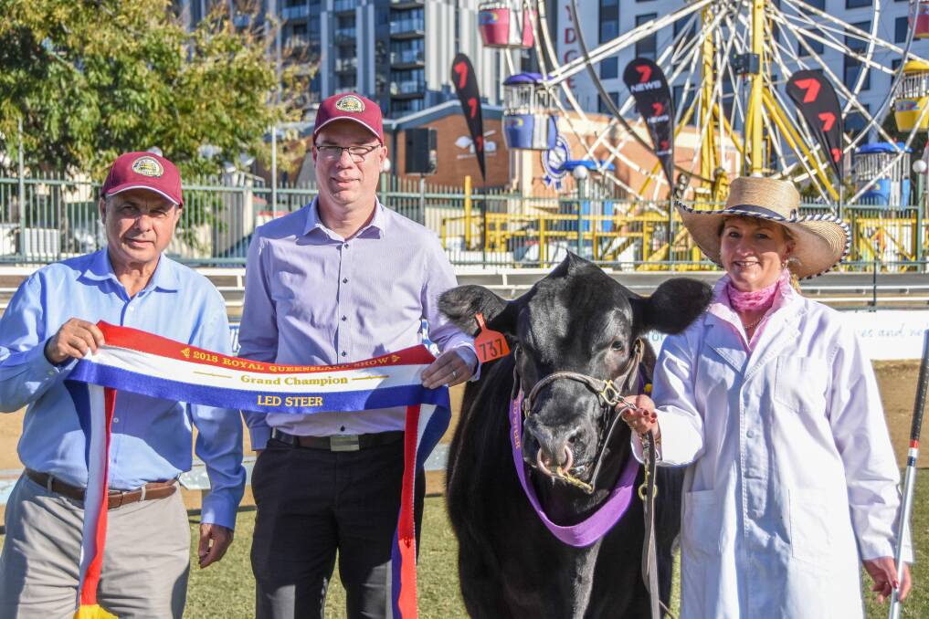 Breakfast Creek Hotel venue manager Sam Gullo and operations manager Jeff Sanson with the grand champion steer and handler Karen Griffiths. 