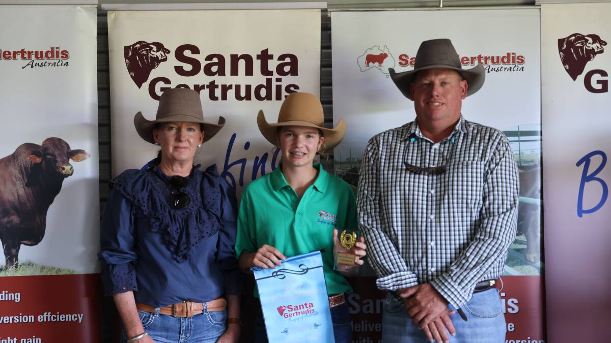 Champion herdsperson Natalie Mulcahy (centre) with Louise and Tony Prentice.