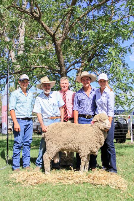 Lachie, Charlie and Felicity Brumpton of Jolly Jumbuck Poll Merino Stud with Don Alexander, Willoughby, Barcaldine, who purchased the $3500 top price ram, and Elders agent Andrew Meara. 
