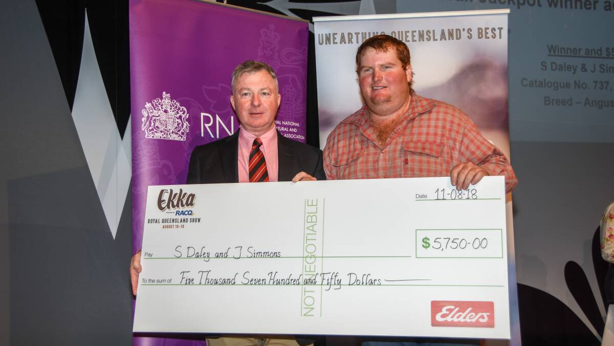 Elders Livestock team member Andrew Meara and champion steer co-owner Shaun Daley after receiving his overall jackpot steer winners cheque. 