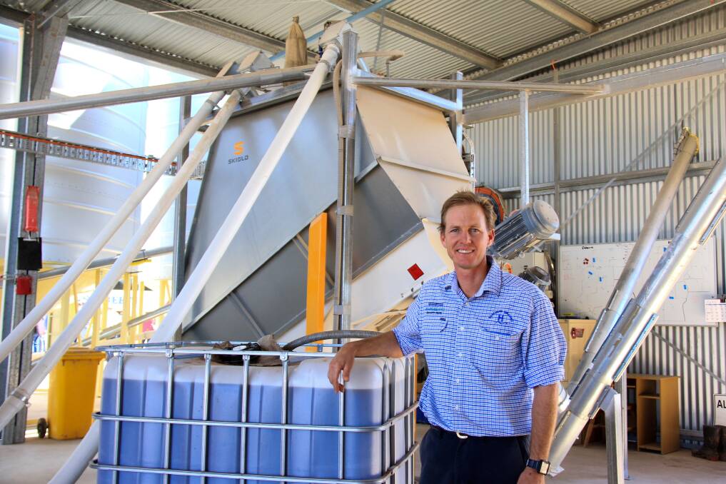 Lachlan Hughes and the on-farm feed mill.