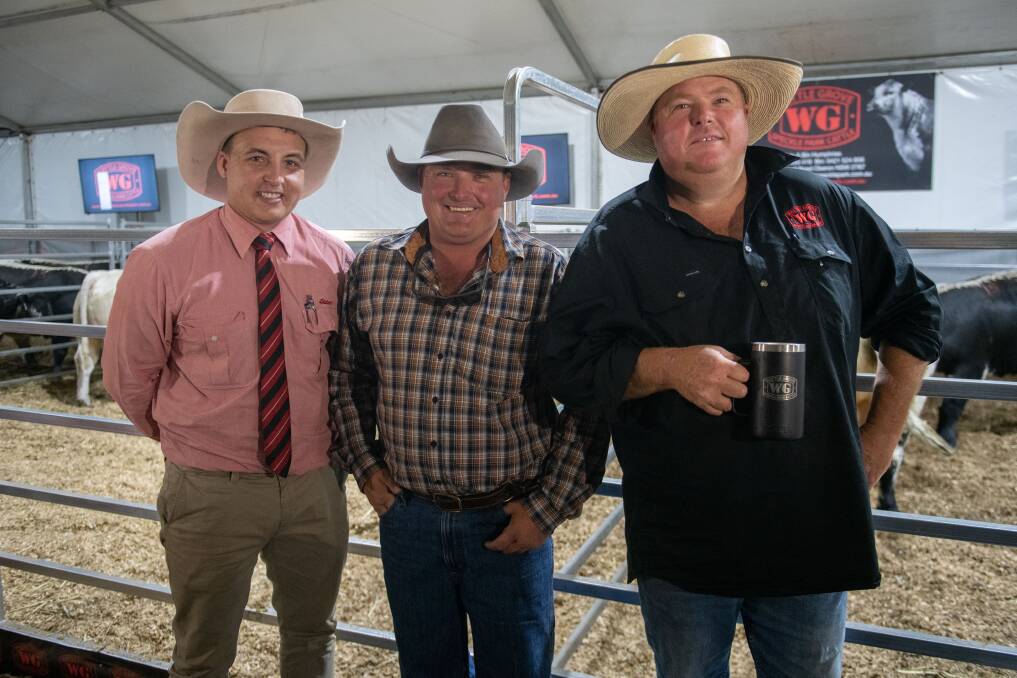 Elders agent Lincoln McKinlay, Brendan Holland representing Speckle Park Brazil and Wattle Grove stud principal Dale Humphries. Photo: Emily Hurst
