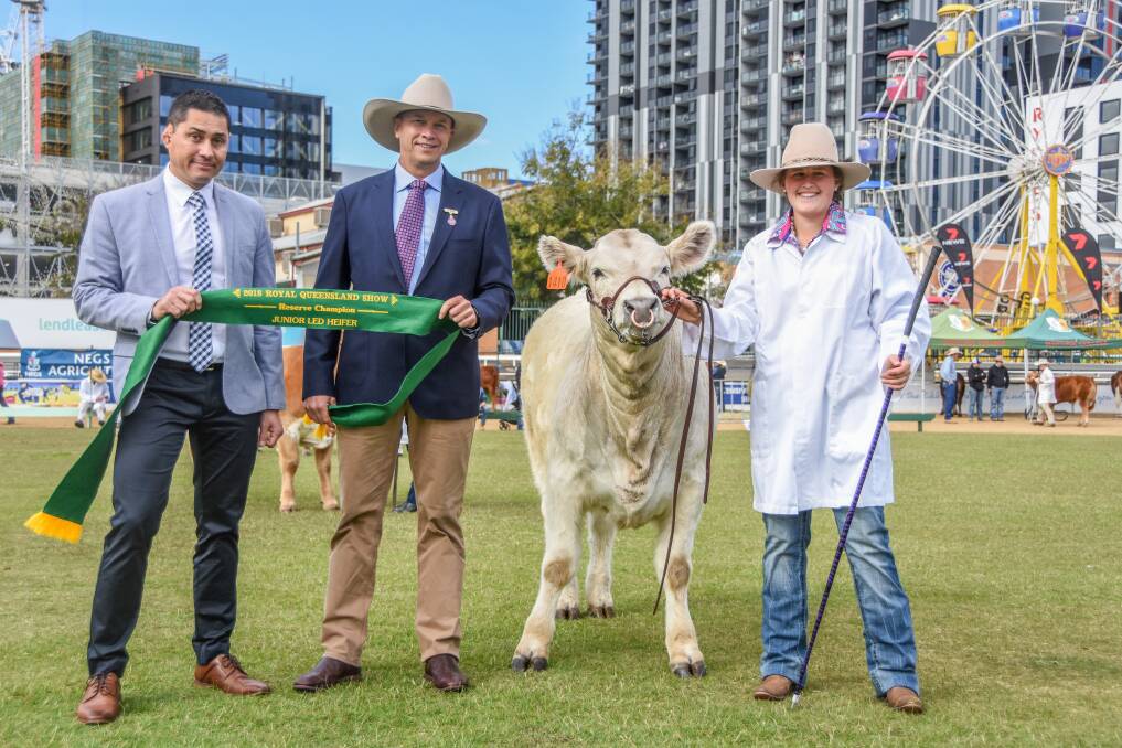 Reserve champion junior led heifer, a Charolais cross from Ben Toll and St John's College in Dubbo, was sashed by Brian Yep, Lendlease, and judge Berry Reynolds, Toowoomba, and held by Courtney Knaggs.