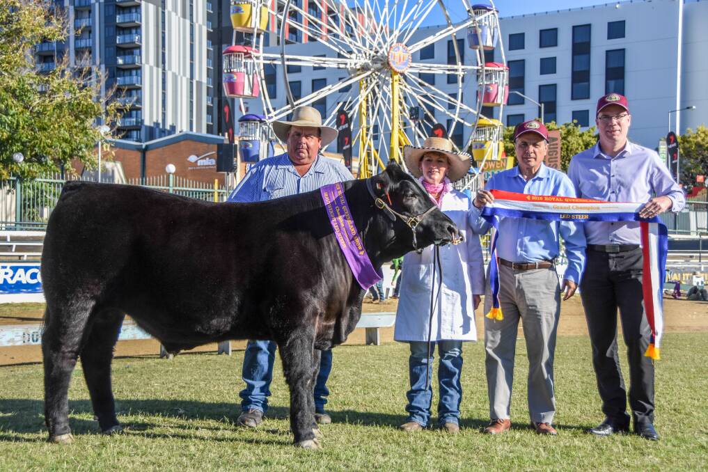 Fitter Stephen Hayward and handler Karen Griffiths with the grand champion steer and successful purchasers from the Breakfast Creek Hotel, Sam Gullo and Jeff Sanson. 