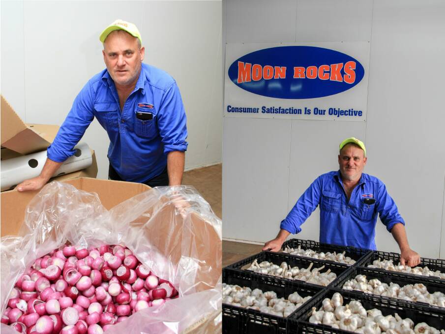 Andrew Moon with some of the onions and garlic from Moon Rocks. 