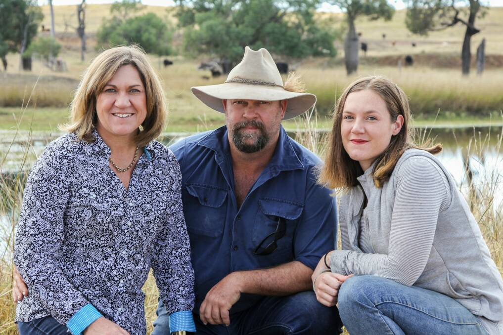 Lisa, Jasen and Chantelle Wain on their property.