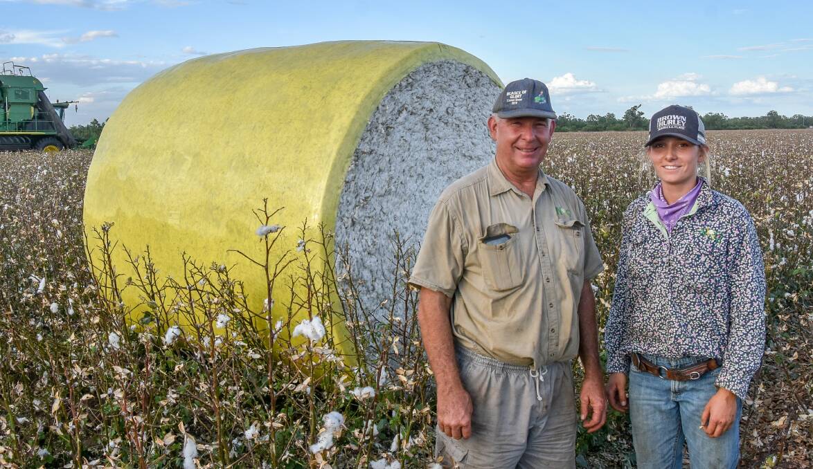 Looking to the future: Comet district cotton grower, Neek Morawitz, Windy Hill and Argoon, with daughter Clementine during harvest of their cotton trial. Photo: Ben Harden 