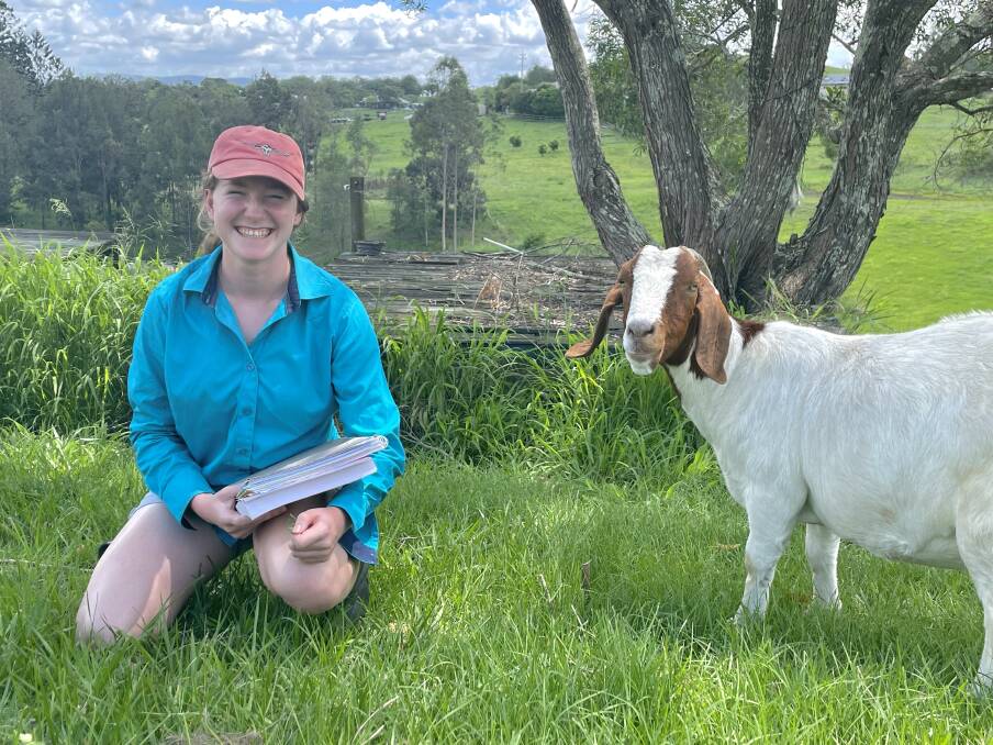 Ferny Grove State High School's Kate Dash celebrates with her goat Snowy after being named the top ranked student for agricultural science in Queensland. Picture: Kelly Mason 