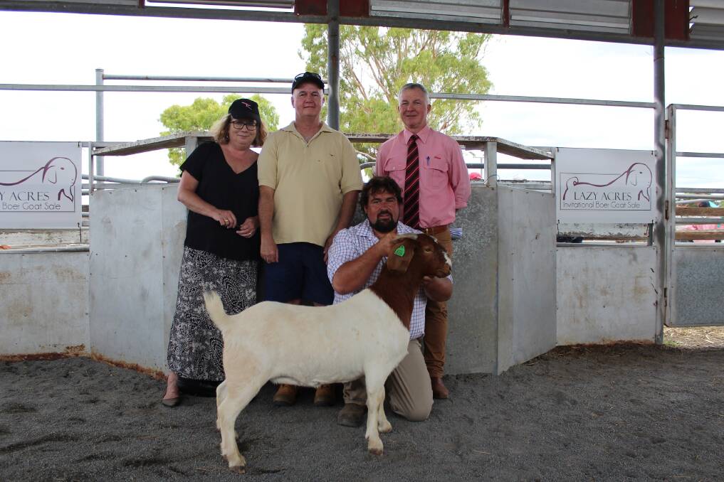 Buyers Sharon and Ian Machin, vendor Benjamin Stanford or Bengara Boer Goats and Elders auctioneer Andrew Meara with the $6200 doe. 