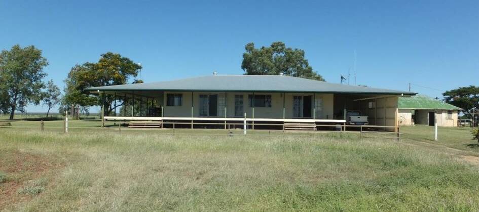 Improvements include the original 1882 sandstone homestead, with the attached new homestead built in 2006.