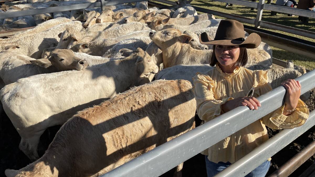 SHEPHERDSON AND BOYD: Maree Duncombe, Conondale, with her Charolais-cross steers that sold for $2030 at the Toogoolawah weaner sale.