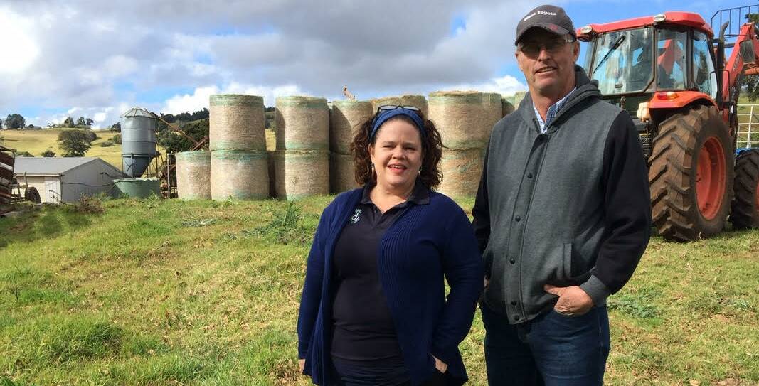 HAY DROP: Rural Aid counsellor Jane McCollum and Queensland Dairyfarmers Organisation state councillor Gary Wenzel. 